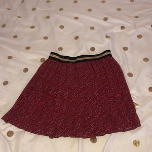 A wine colored skirt.